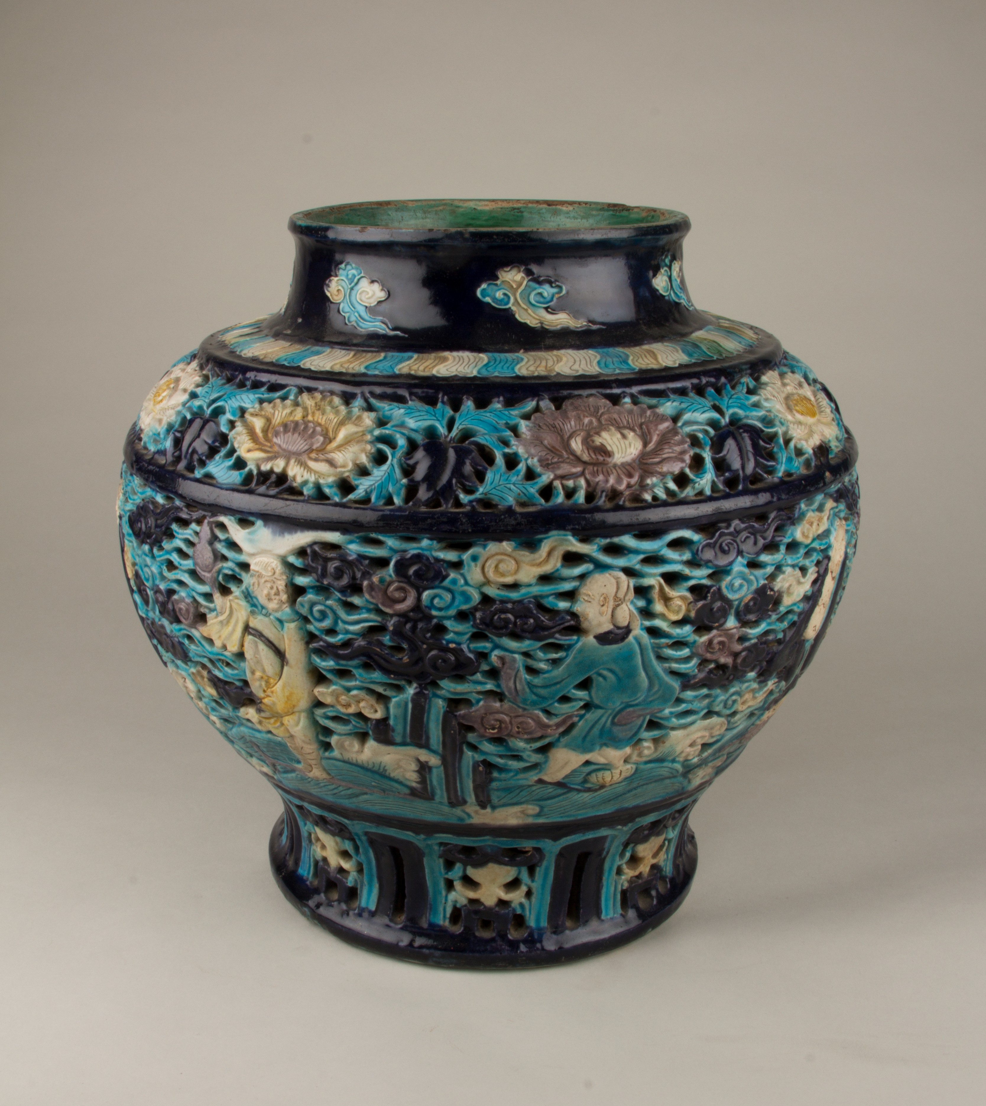 Fahua ware jar decorated with relief scenes of the Eight Immortals.