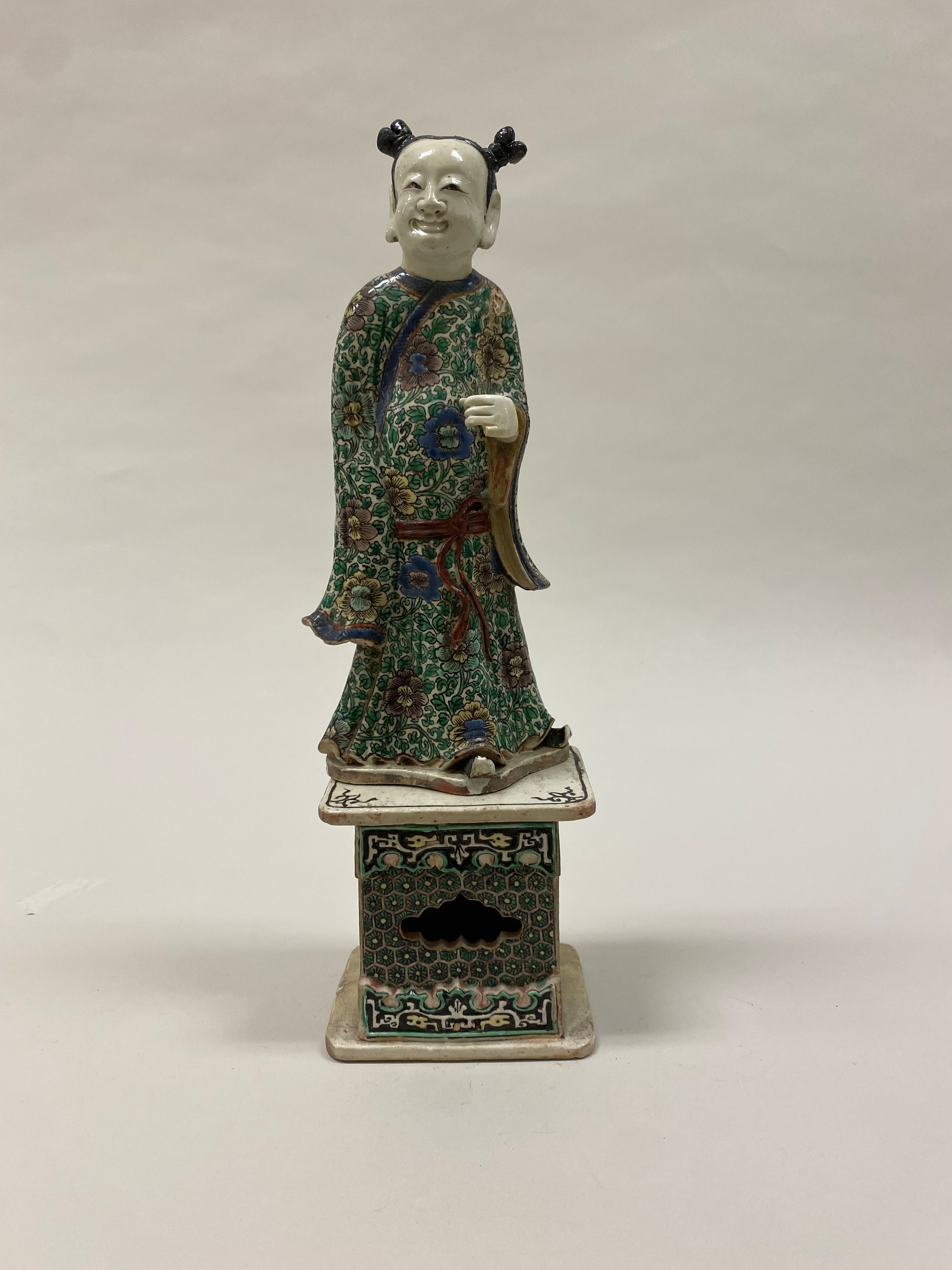 Polychrome ceramic figure of Han Xiangzi, one of the Eight Immortals.
